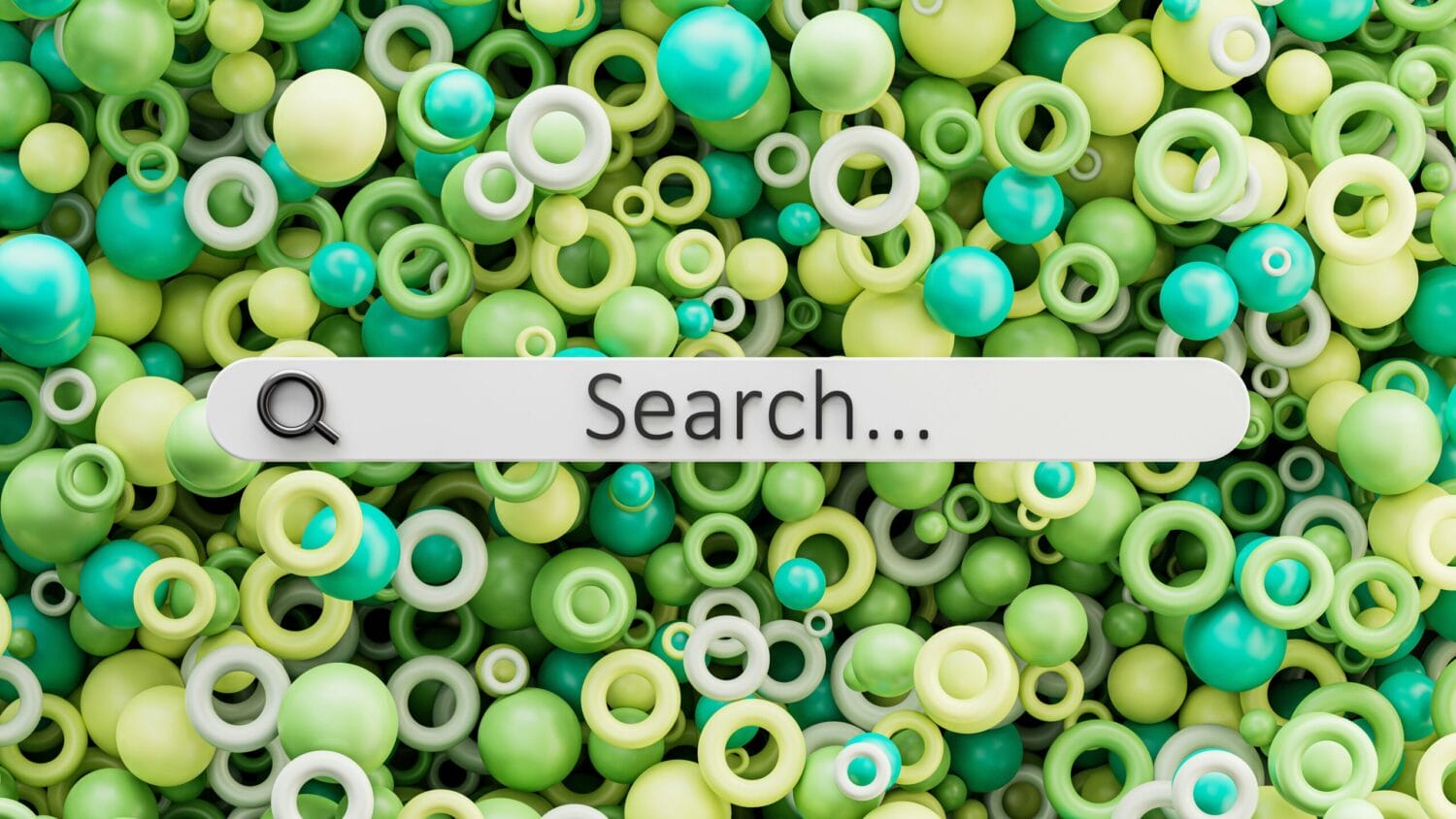 a close up a beads in various hues of green with a search bar over top.