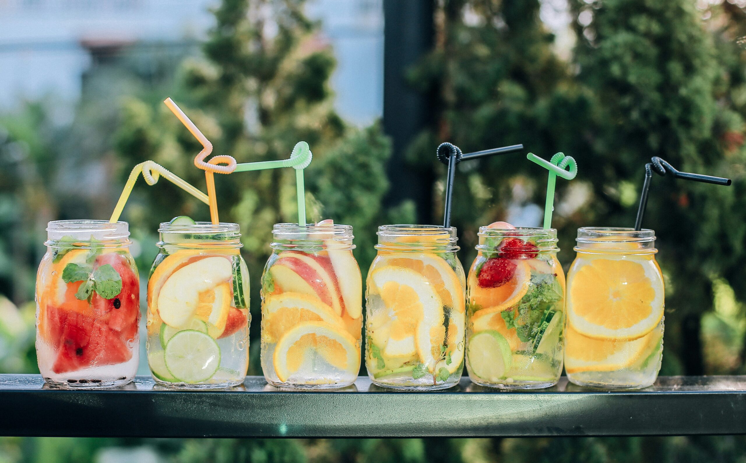 Summer fundraising ideas for A-thons summer drinks in mason jars lined up on a table