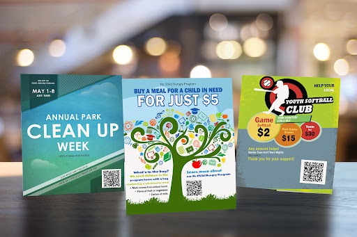 Nonprofit marketing flyers promoting small-dollar giving, QR codes, and local events on a table
